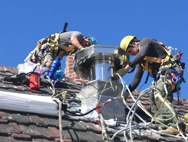 Protective chimney cap installed by New Franklin Chimney Sweep in New Franklin, OH