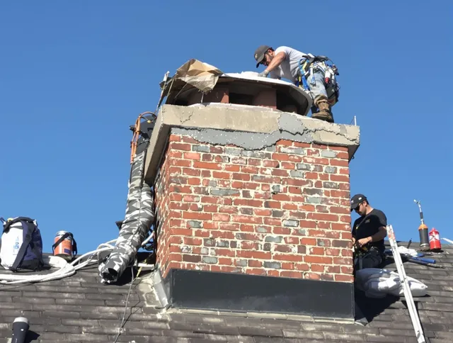 New Franklin Chimney Sweep installing a custom chimney crown in New Franklin, OH
