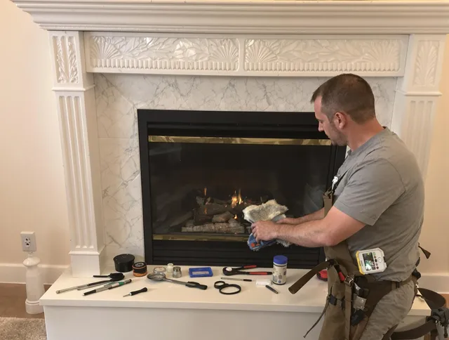 New Franklin Chimney Sweep performing fireplace maintenance in New Franklin, OH