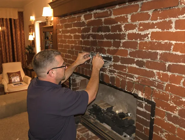 New Franklin Chimney Sweep expert fixing a fireplace in New Franklin, OH